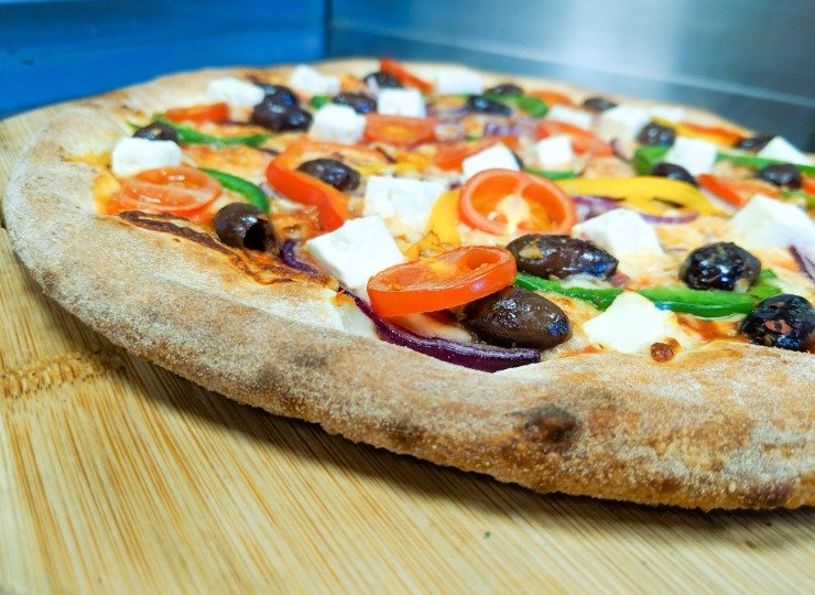 Fine Pizza from Woody's Pizza Johnstone, Paisley, Barrhead. Delivery and Takeaway stone baked pizza topped with feta, olives and tomatoes
